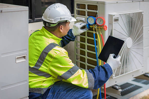 Professional Heat Pump Repair technician working in Whitesboro, AL